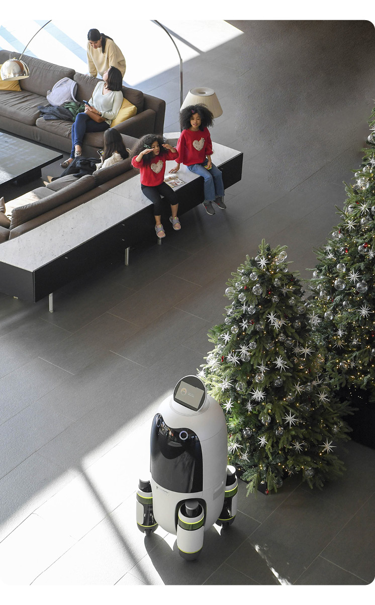 A delivery robot moving in a hotel lobby