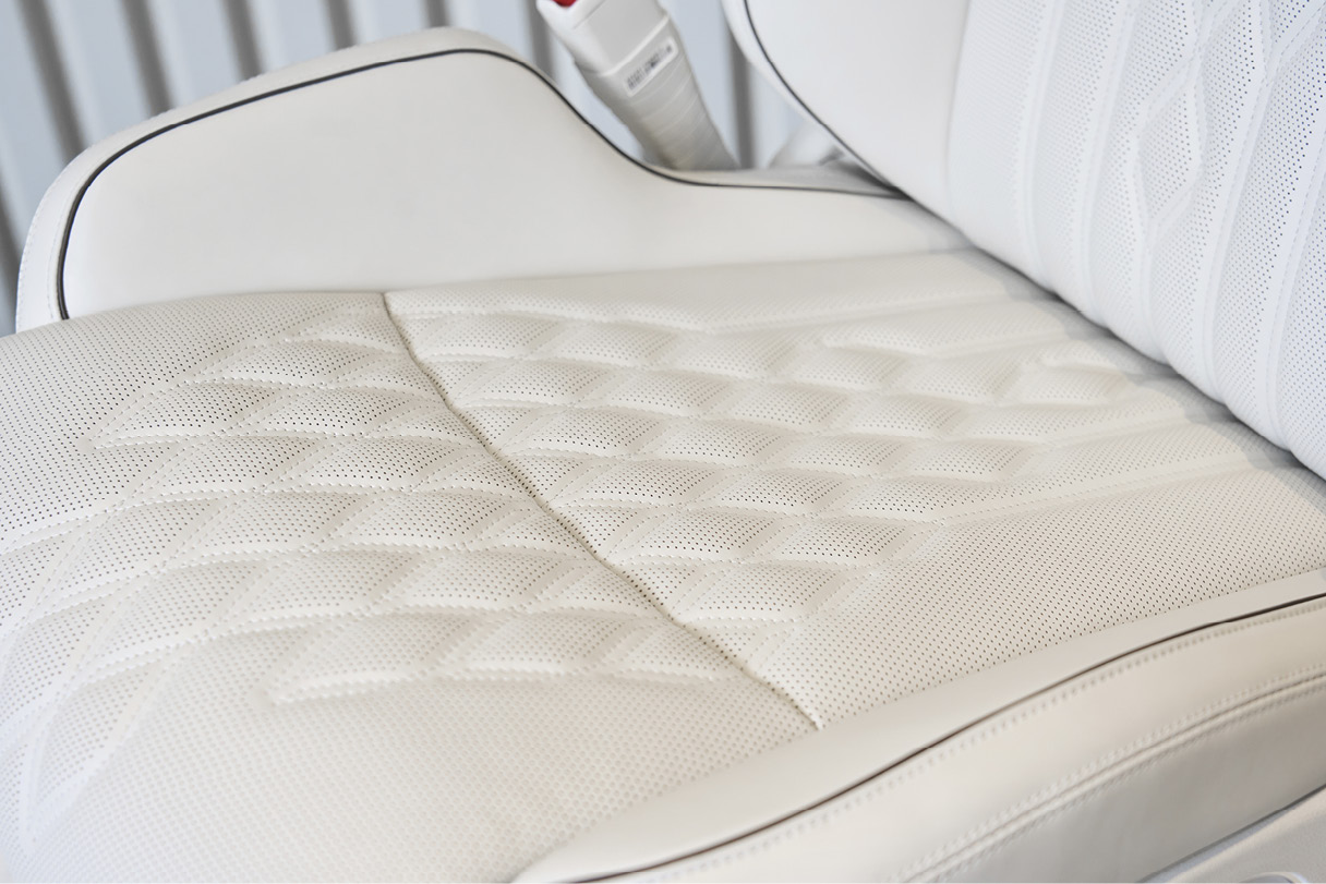 Ergo motion seat cushioning with quilting stitching