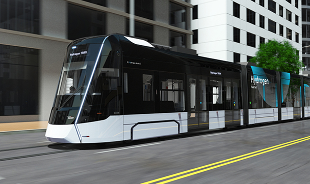A hydrogen-electric tram made by Hyundai Rotem is running from right to left.