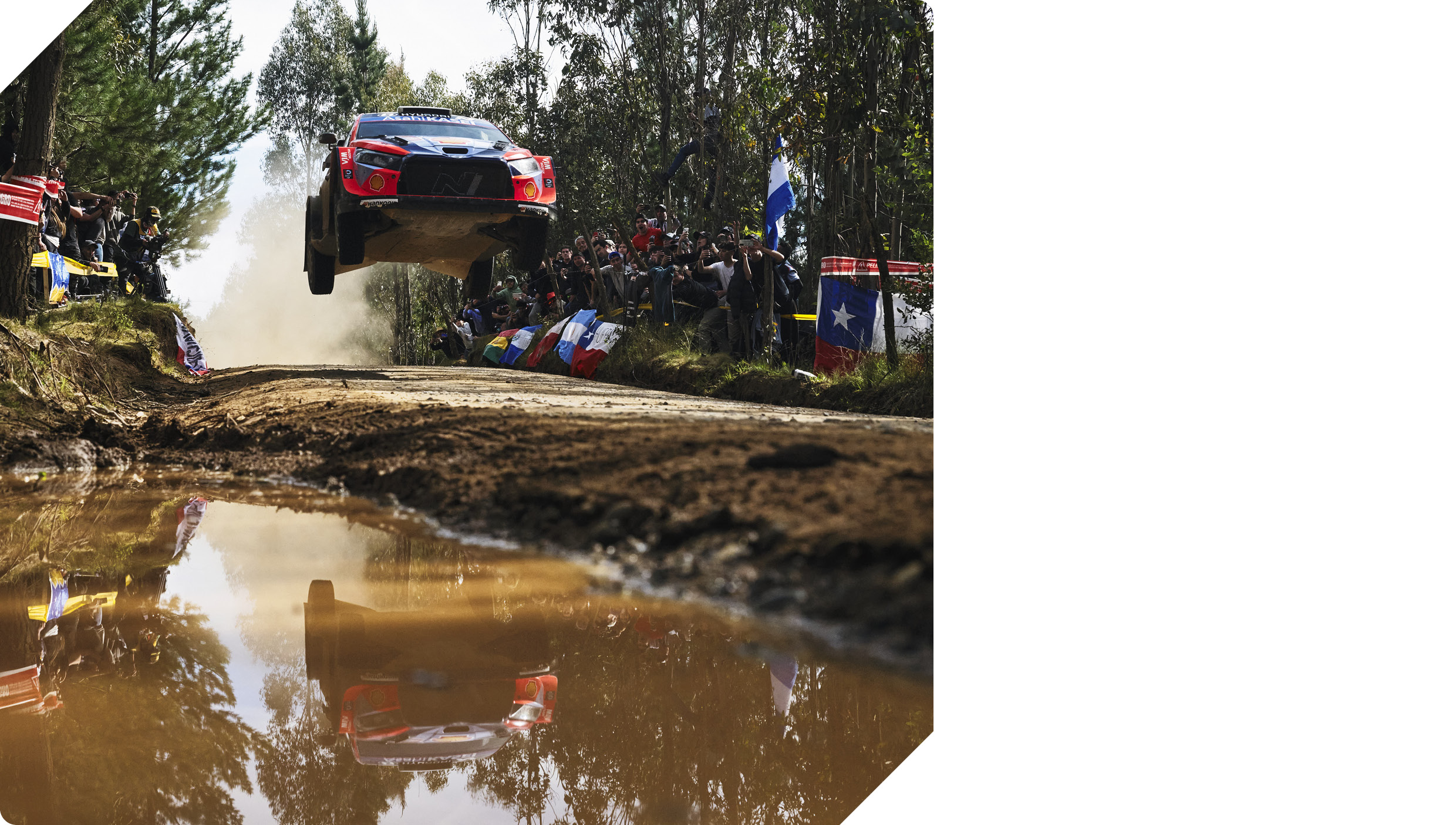 The rally car is jumping