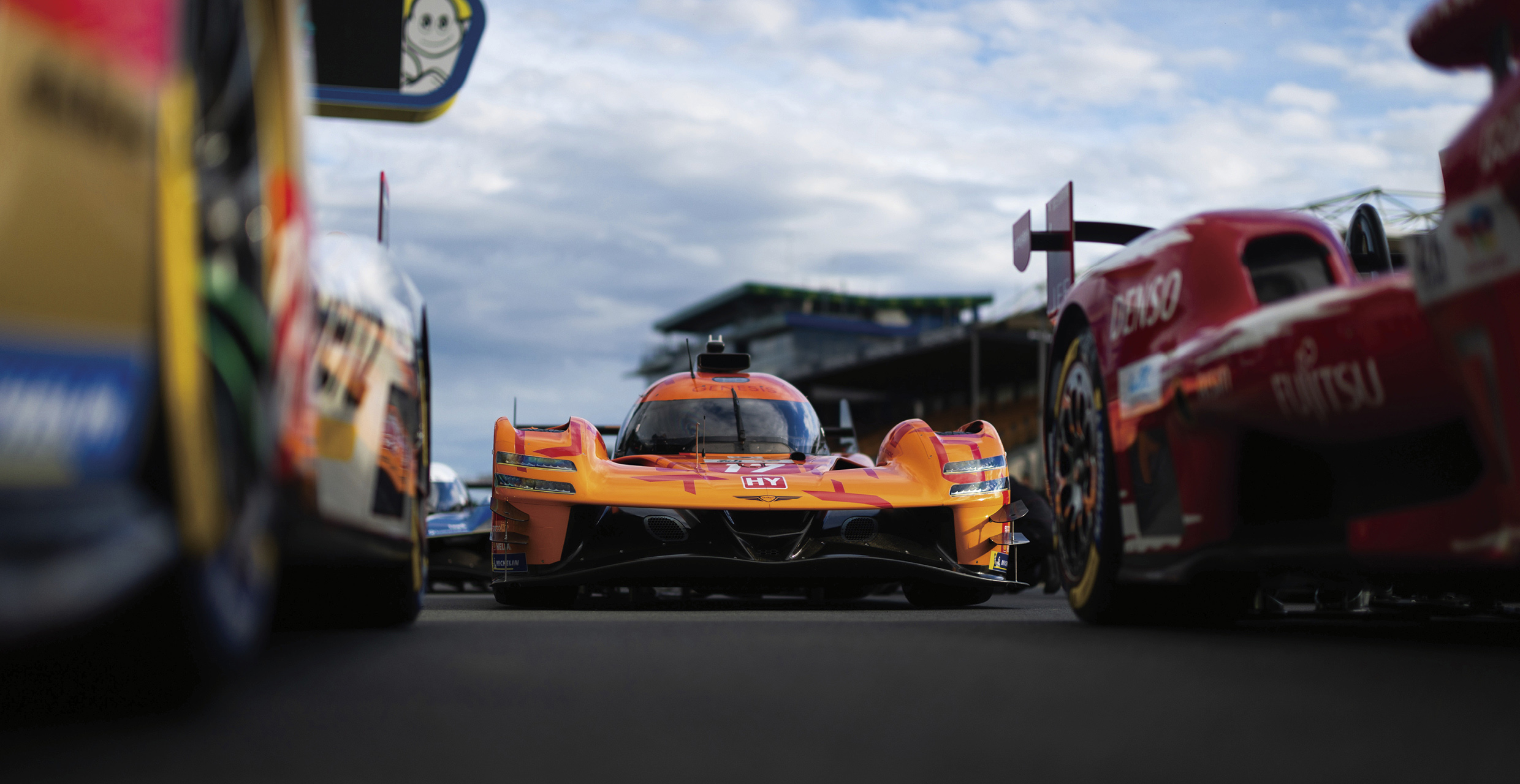 Genesis hypercars standing on the grid, preparing for the race