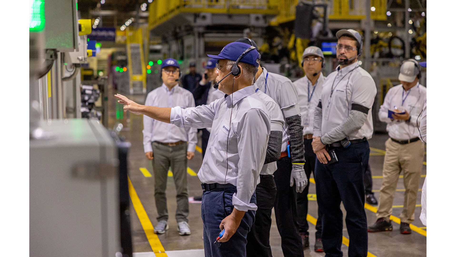 Hyundai Motor Group Chairman Euisun Chung touring the site with officials in Brazil