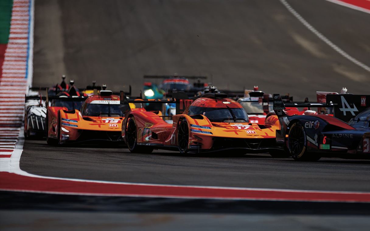 A hypercar racing on a track