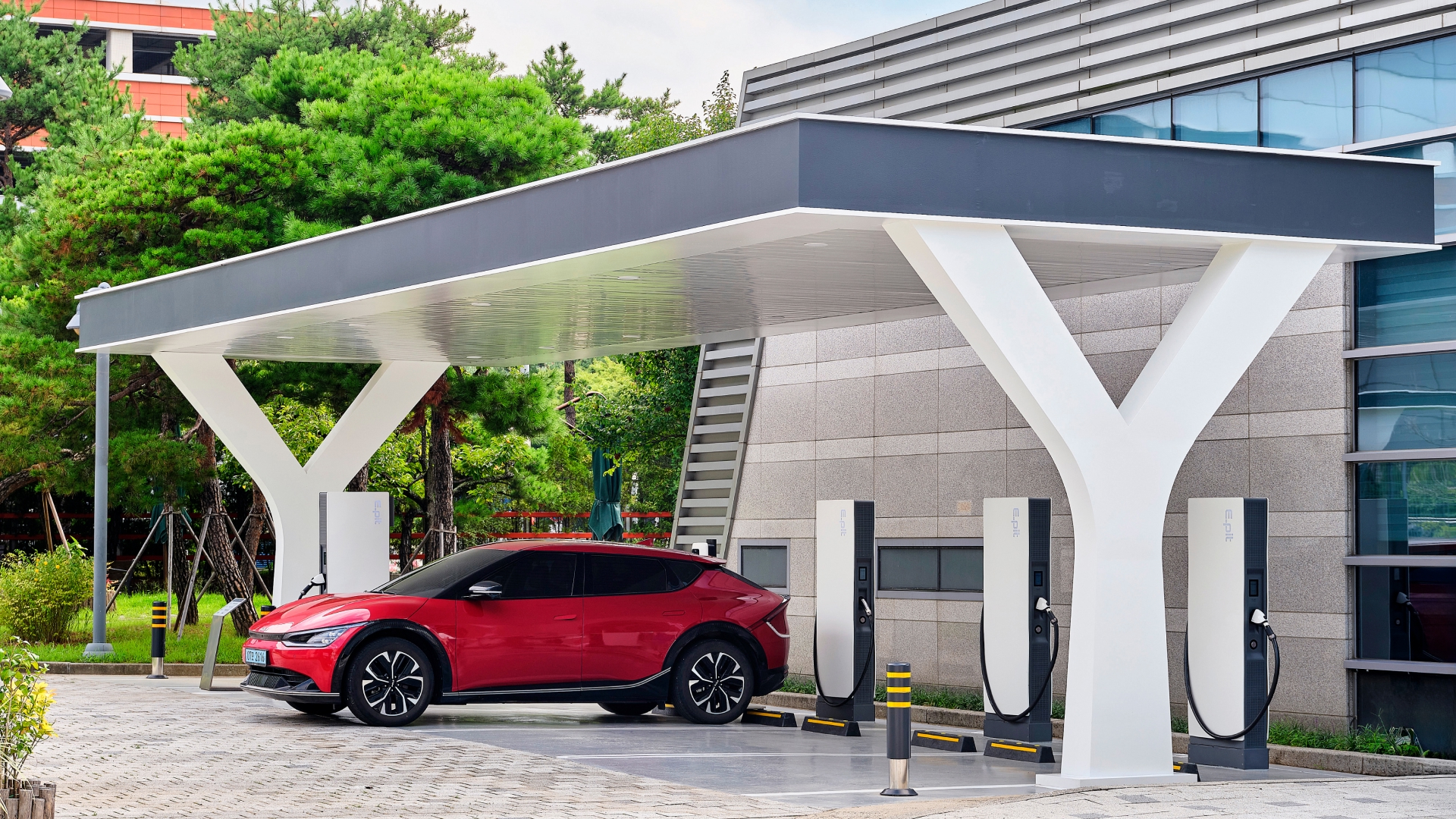 An electric vehicle charging at the EV charging station