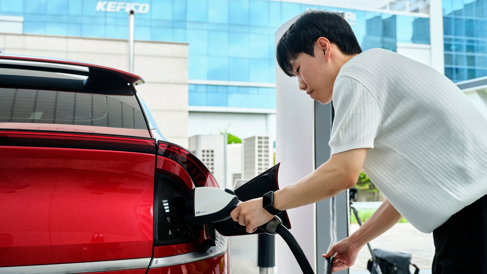 A charging connector being plugged into a vehicle