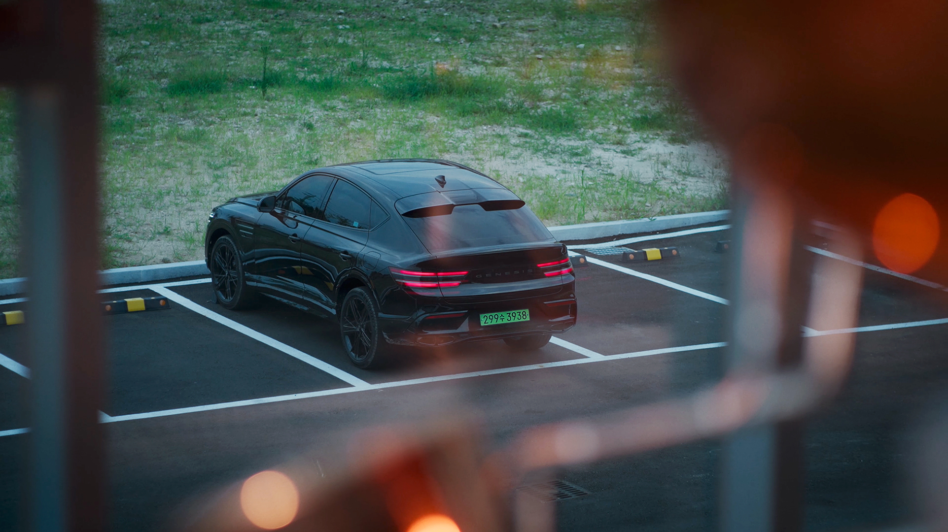 Genesis GV80 Coupe viewed through a window