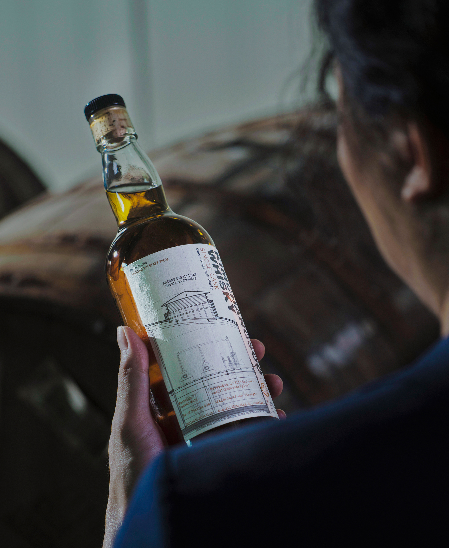 Looking at a bottle of whisky