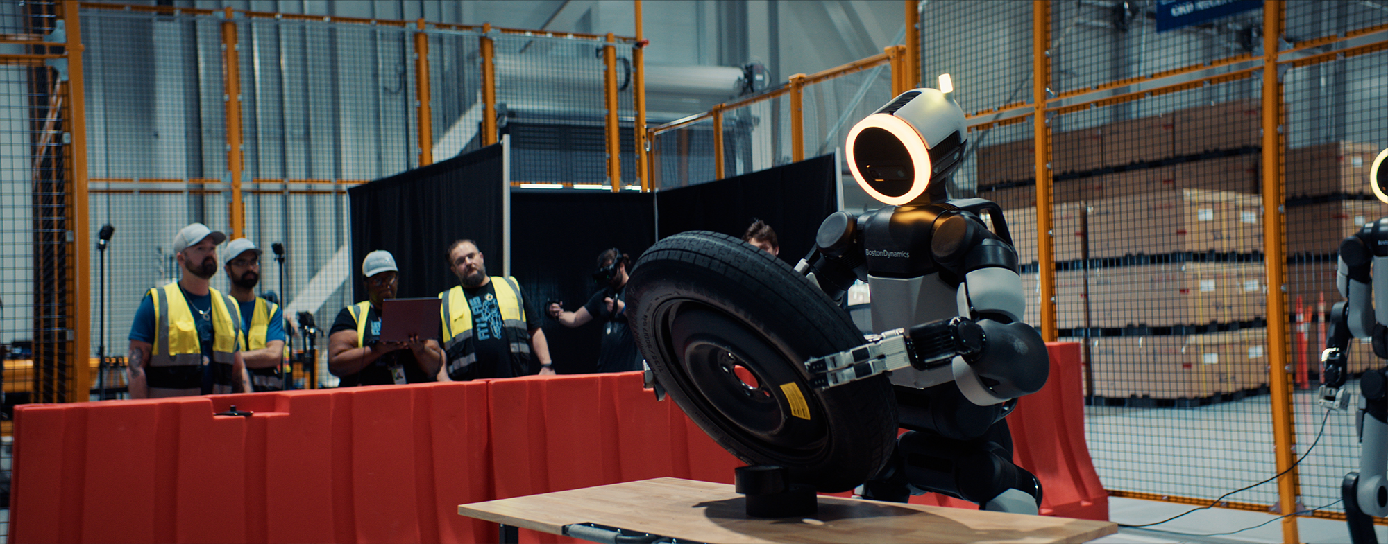 Boston Dynamics Atlas performing a task at an automotive manufacturing plant