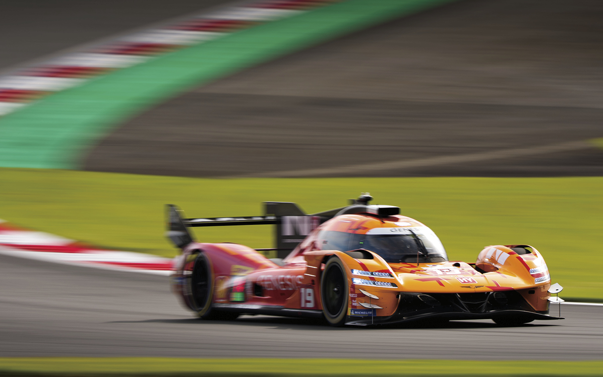 Genesis race car driving on a circuit