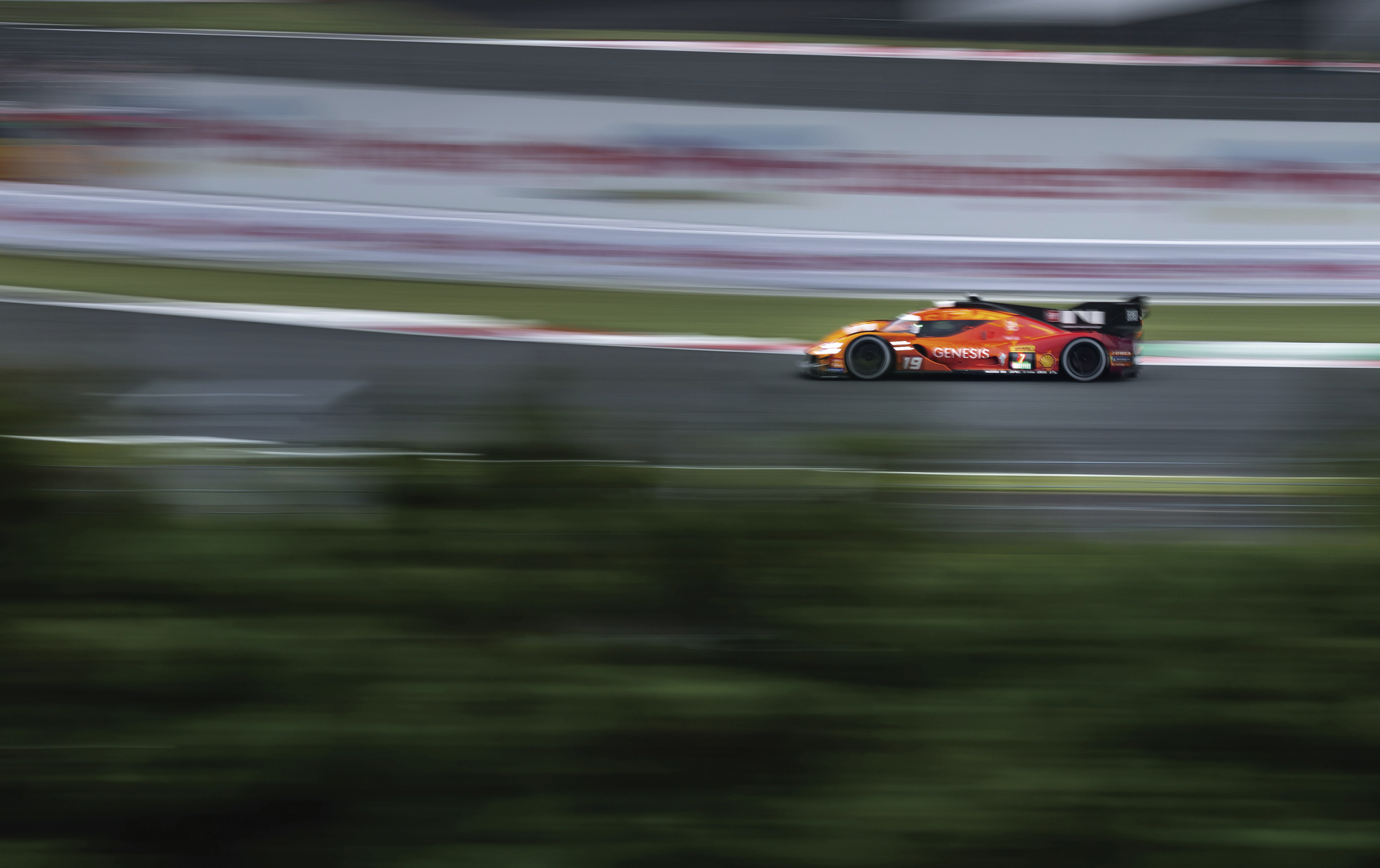 Genesis race car driving on a circuit