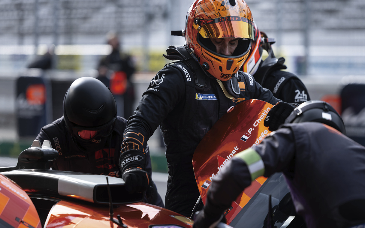 Inspecting race car at the pit