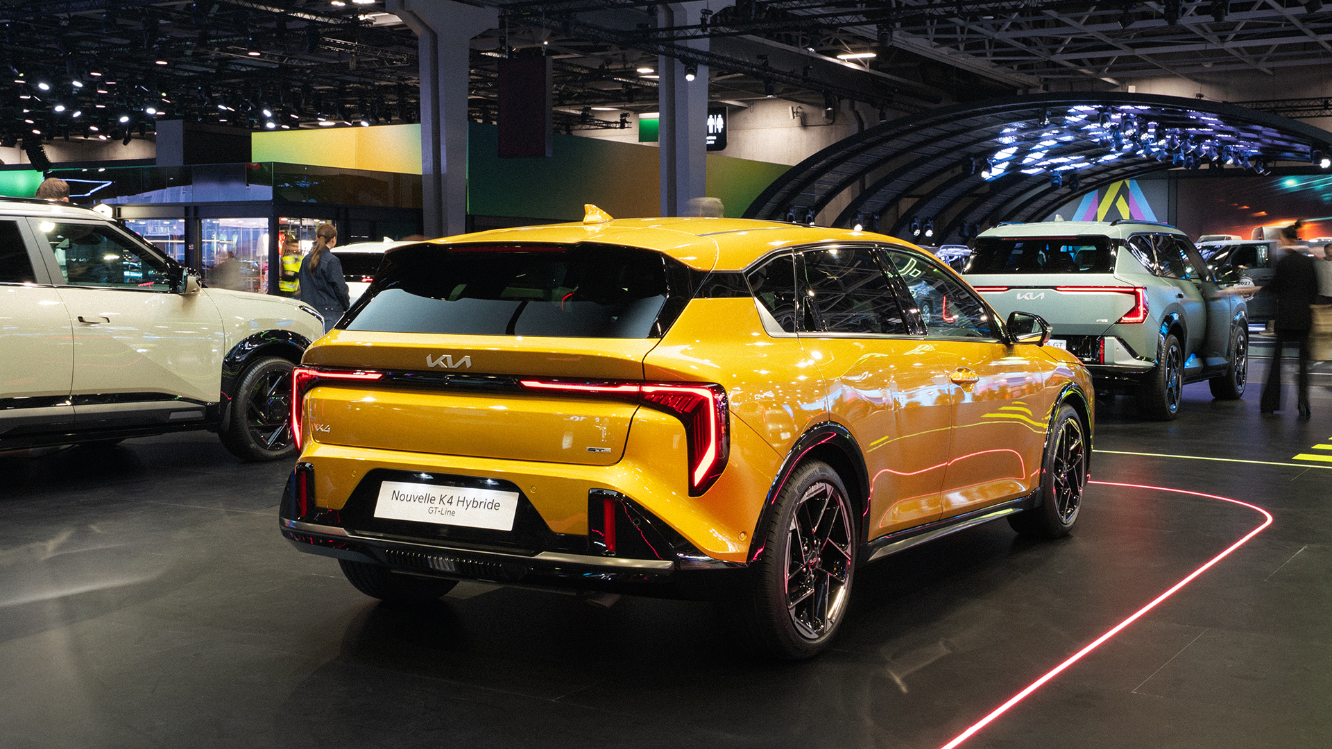 Rear view of the Kia K4 displayed at the 2026 Paris Motor Show exhibition hall