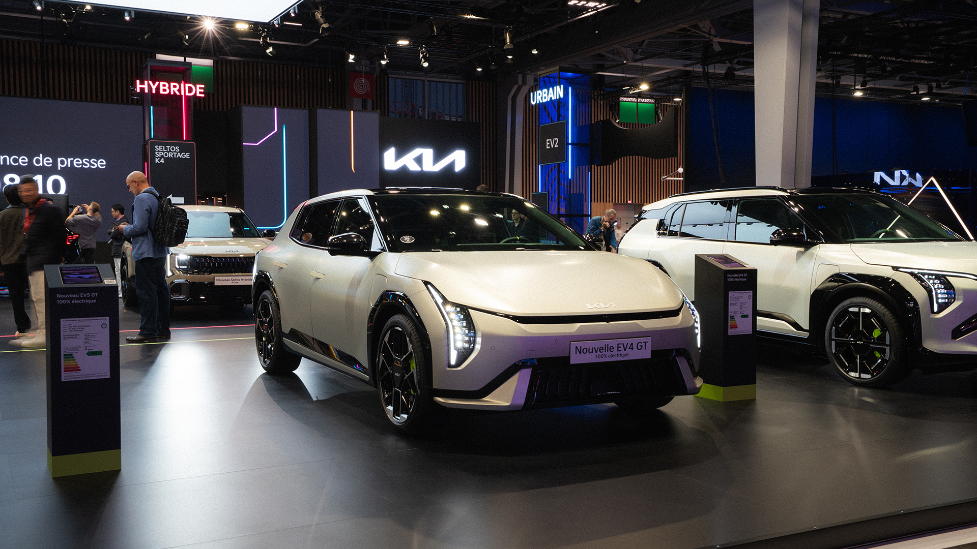 Kia EV4 vehicle displayed at the 2026 Paris Motor Show exhibition hall