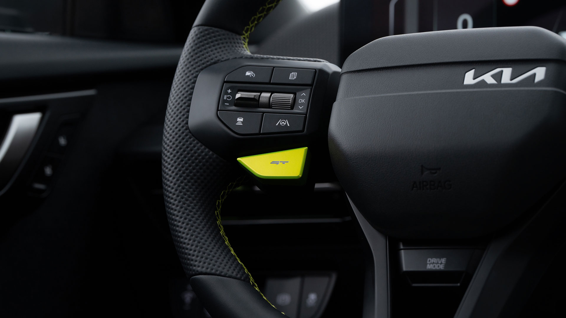 EV6 GT steering wheel featuring neon green stitching and a GT mode button